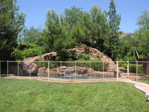 Safety mesh fence installed along backyard pool perimeter in Sarasota Florida