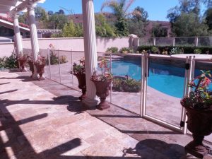 Elegant pool fence installed in an Orange County patio