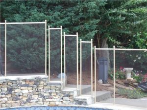 Vertical pool safety fence with mesh installed around a pool in Sebastian for child safety and protection