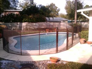 Black mesh pool fence installed for backyard safety in Orlando