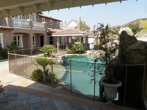 Luxury home in Orange County with a mesh pool safety fence