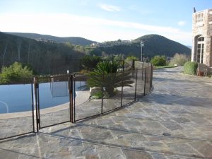 Pool fence in Ventura securing a backyard pool with scenic views
