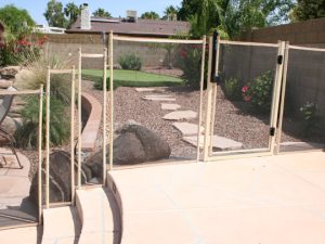 Child-safe mesh pool gate in backyard Houston, TX