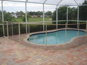 Secure mesh pool fence installed around a free form pool in Tampa Bay