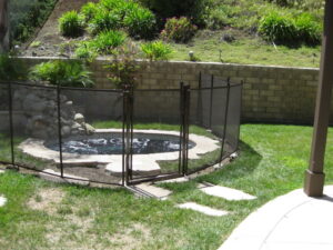 Pool fence in Santa Barbara securing a backyard spa, providing safety for families and pets