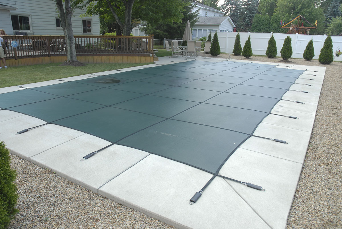 Rectangular winter pool cover in the cold.