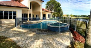 Removable swimming pool fence in Ocala FL around custom pool and spa