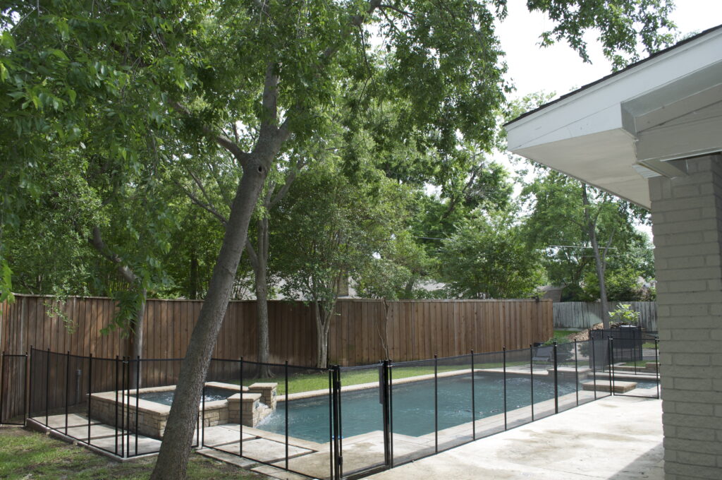 Pool safety fence installed around a residential pool in Connecticut, ensuring compliance with pool fence requirements