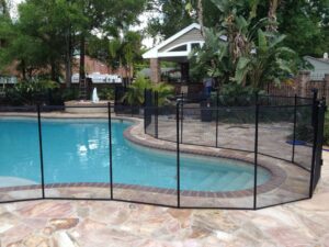 black-mesh-pool-fence-around-backyard-pool-st-augustine