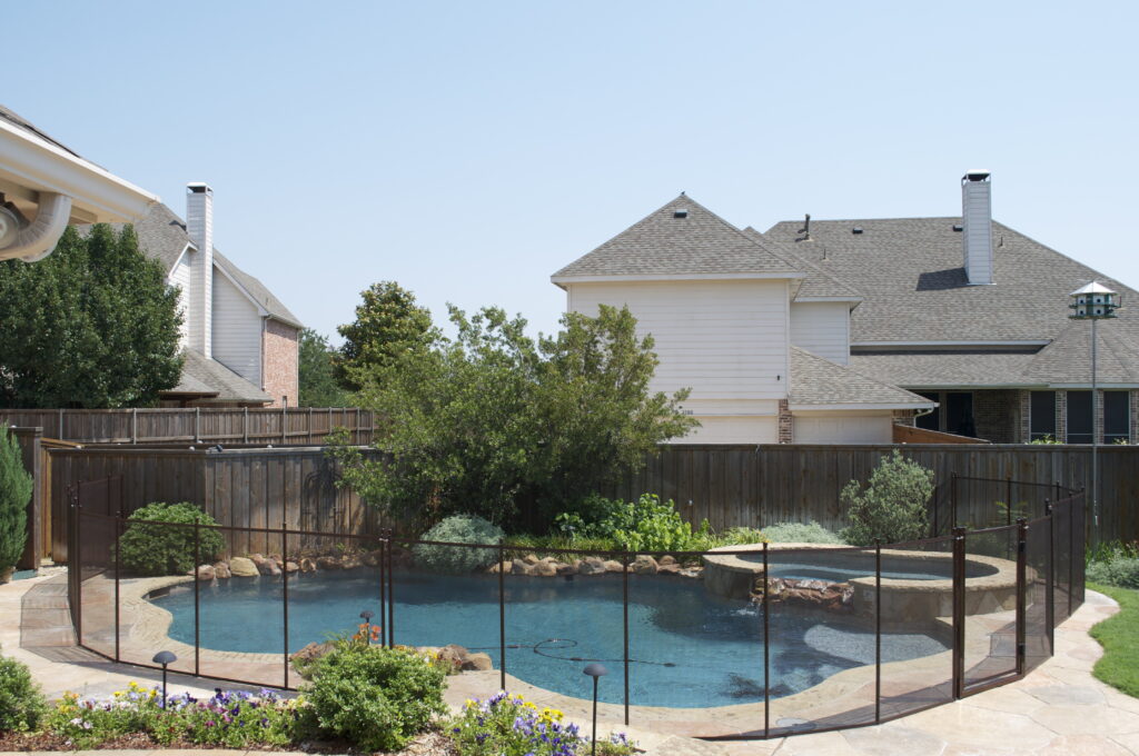 Backyard pool in Tucson with uneven fencing angles and gate placement that may affect safety and compliance.