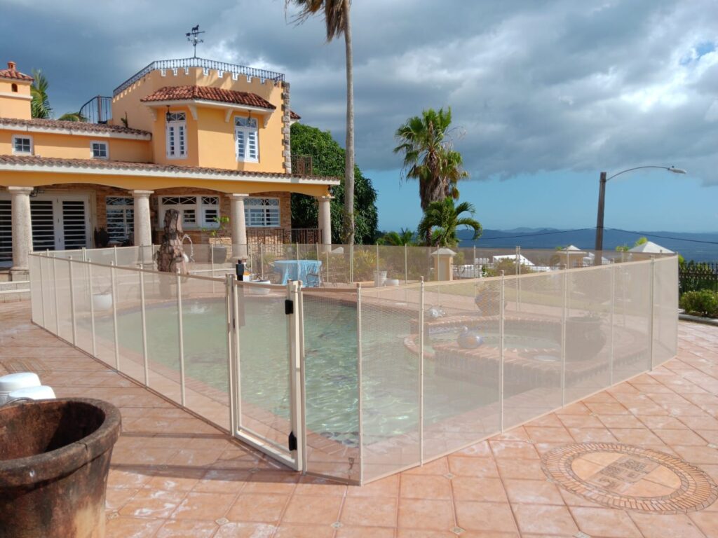 Child-safe mesh pool fence in an Orlando backyard, designed to prevent accidents and meet Florida safety standards.